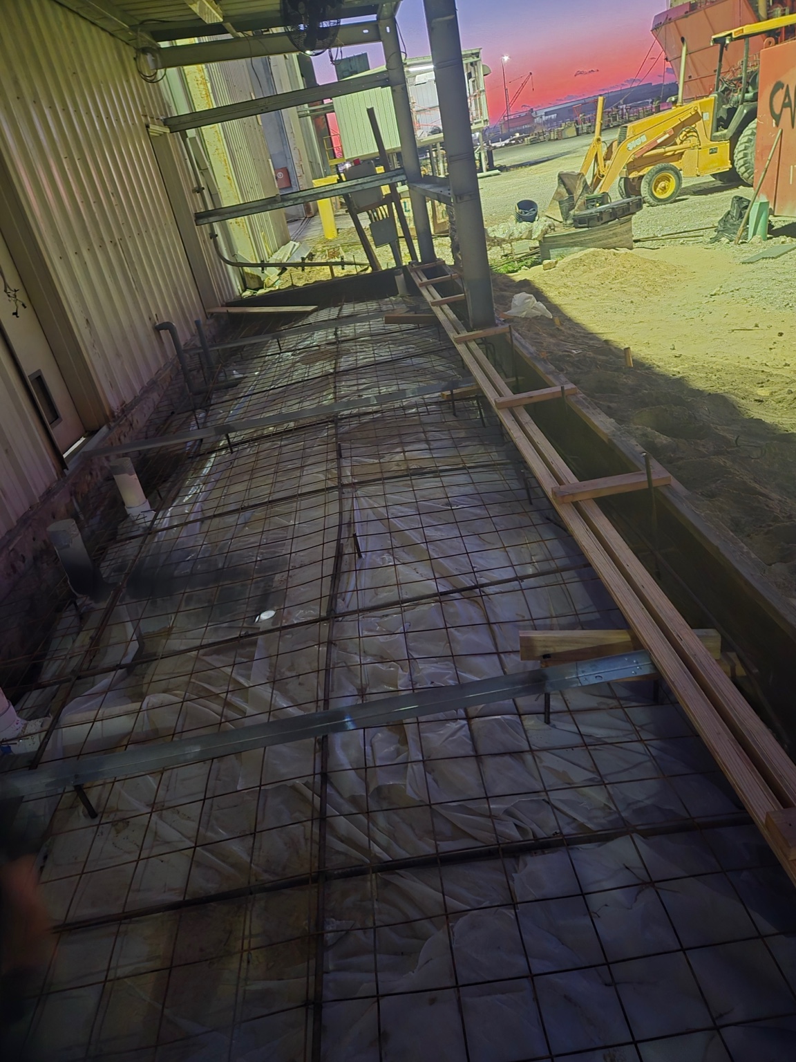 Concrete slab preparation with reinforcing steel