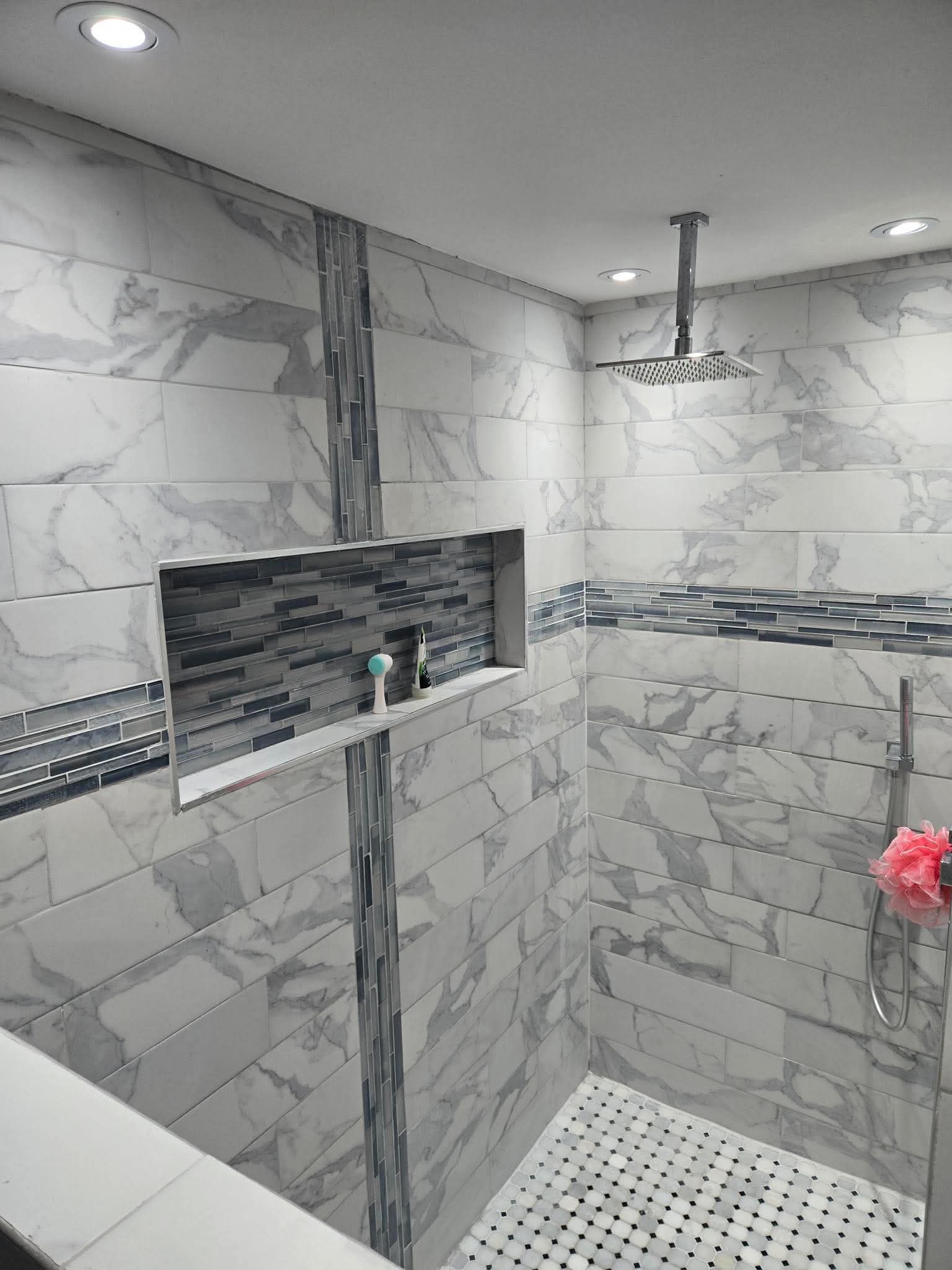 Tiled walk-in shower with inset shelf